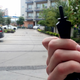 A resident holds up an electronic key used to open an apartment door at the South Side Flats in this Monday, Sept. 10 2018 photo in Dallas.